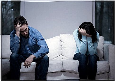 Couple arguing on sofa