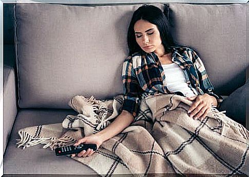 A woman sleeping on the couch.