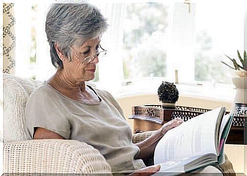 Elderly woman reading book 