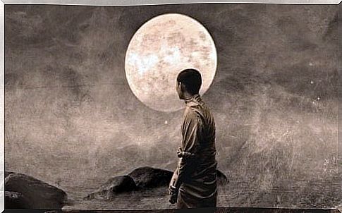 Buddhist monk in front of the moon