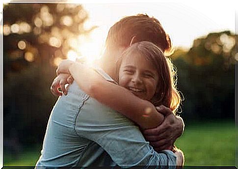 A man hugging a girl.