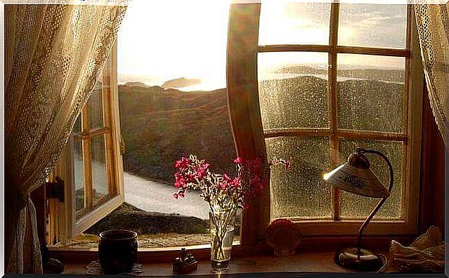 An open window that shows a beautiful landscape.