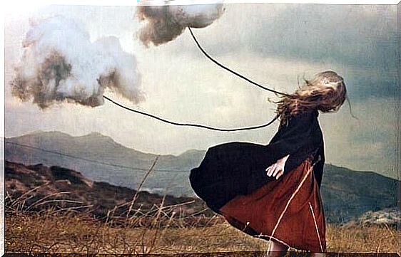 Woman pulls clouds behind her