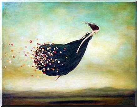 woman flying with flowers