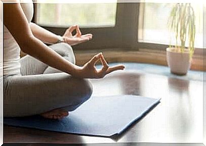 Woman meditating at home