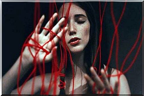 Woman trapped in red thread