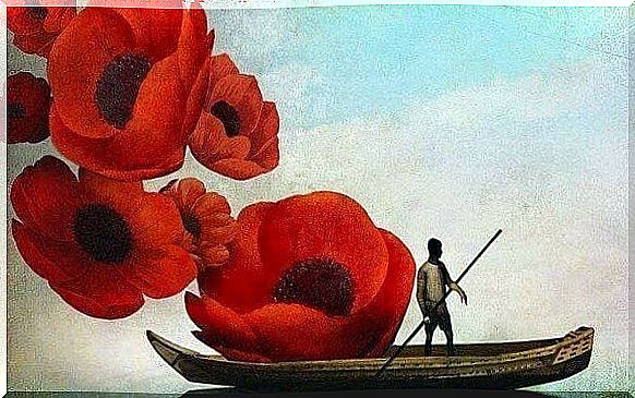 Man sailing by large flowers