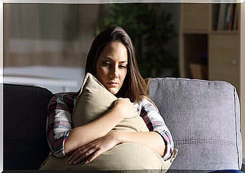 A woman squeezing a pillow.