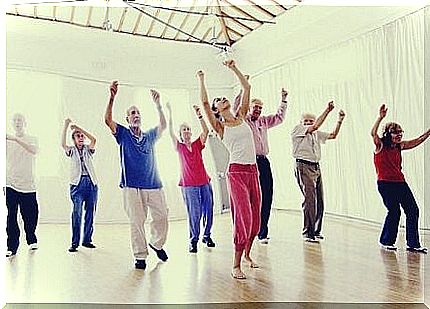 A group of elderly people in a dance class