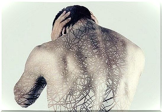 Man with his back full of roots