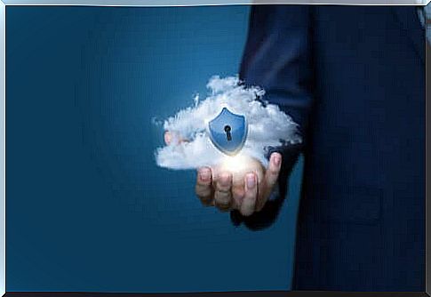 A woman holding a cloud in her hands that symbolizes the computer screen metaphor.