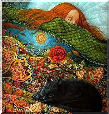 Woman and cat sleeping